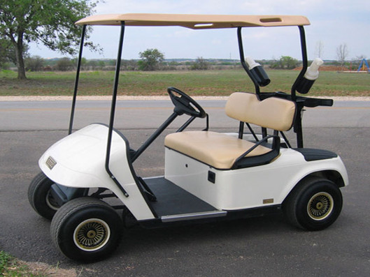 A white golf cart rental.
